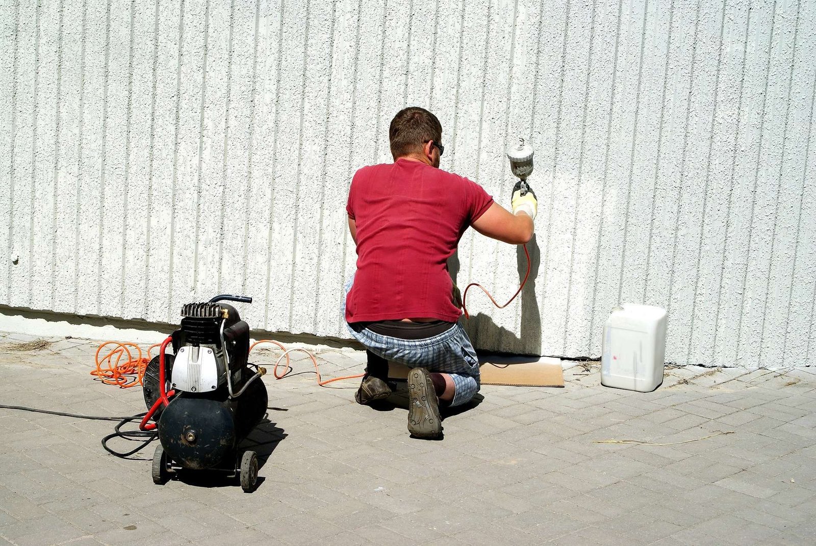 A man Spraying Polyurethane